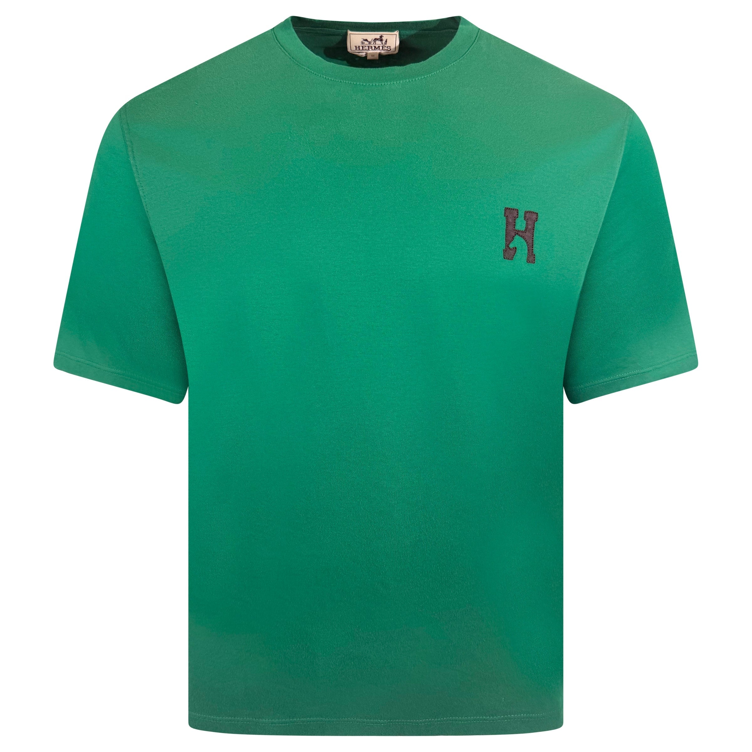 HERMES GREEN LOGO T SHIRT - MEDIUM | PRE OWNED - Affluent ArchivesUsed HIGH END DESIGNER CLOTHING