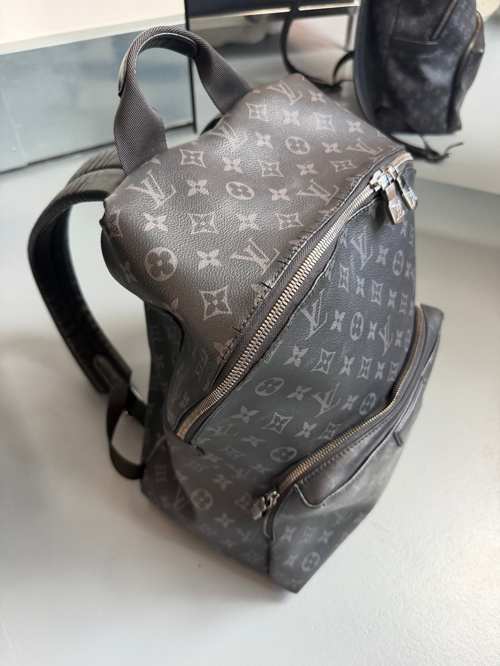 LOUIS VUITTON DISCOVERY BACKPACK | PRE OWNED ( - Affluent ArchivesUsed HIGH END DESIGNER CLOTHING