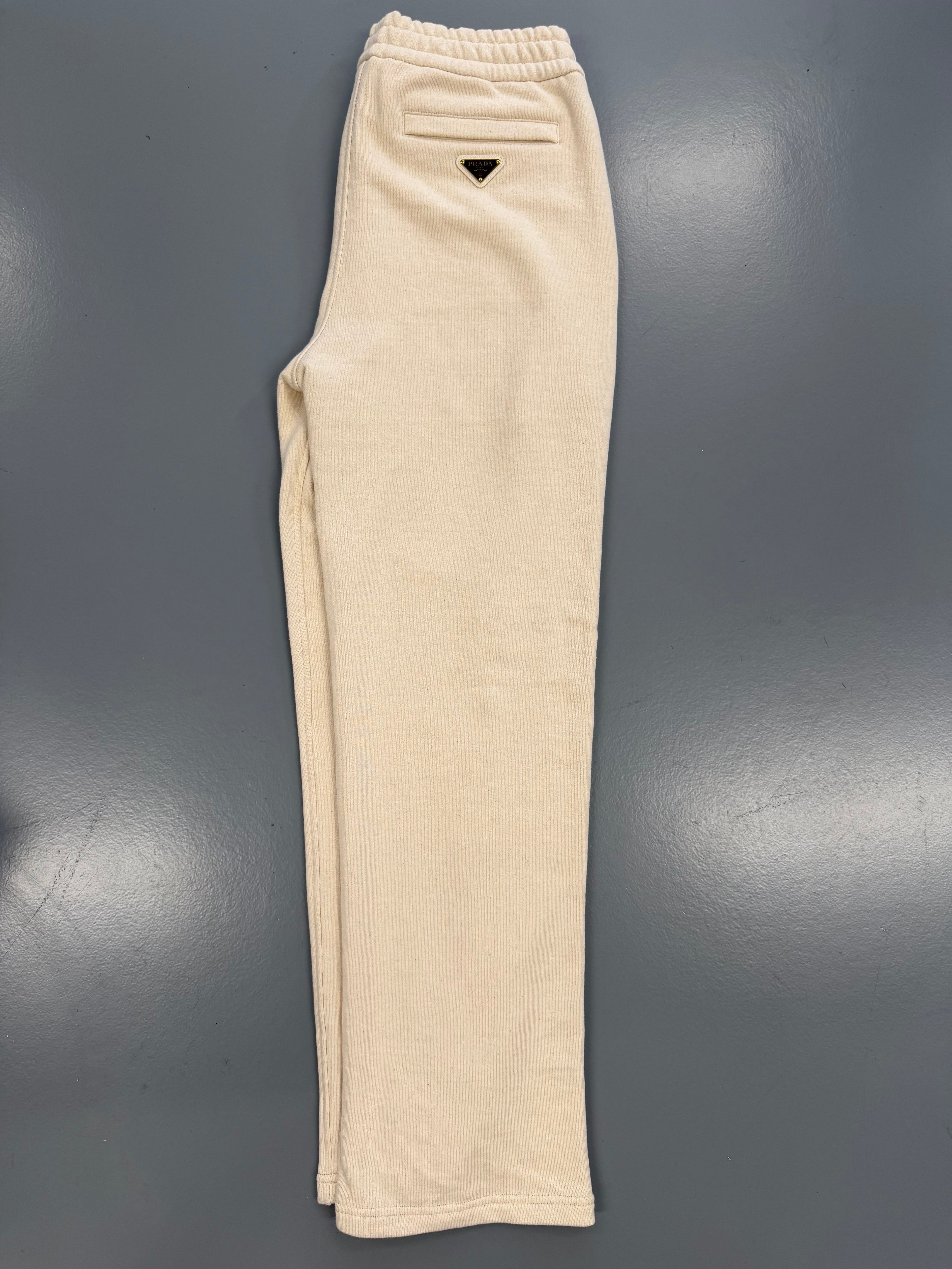 PRADA BEIGE PLAQUE TRACK PANTS - SMALL (Fit Large) - Affluent ArchivesUsed HIGH END DESIGNER CLOTHING