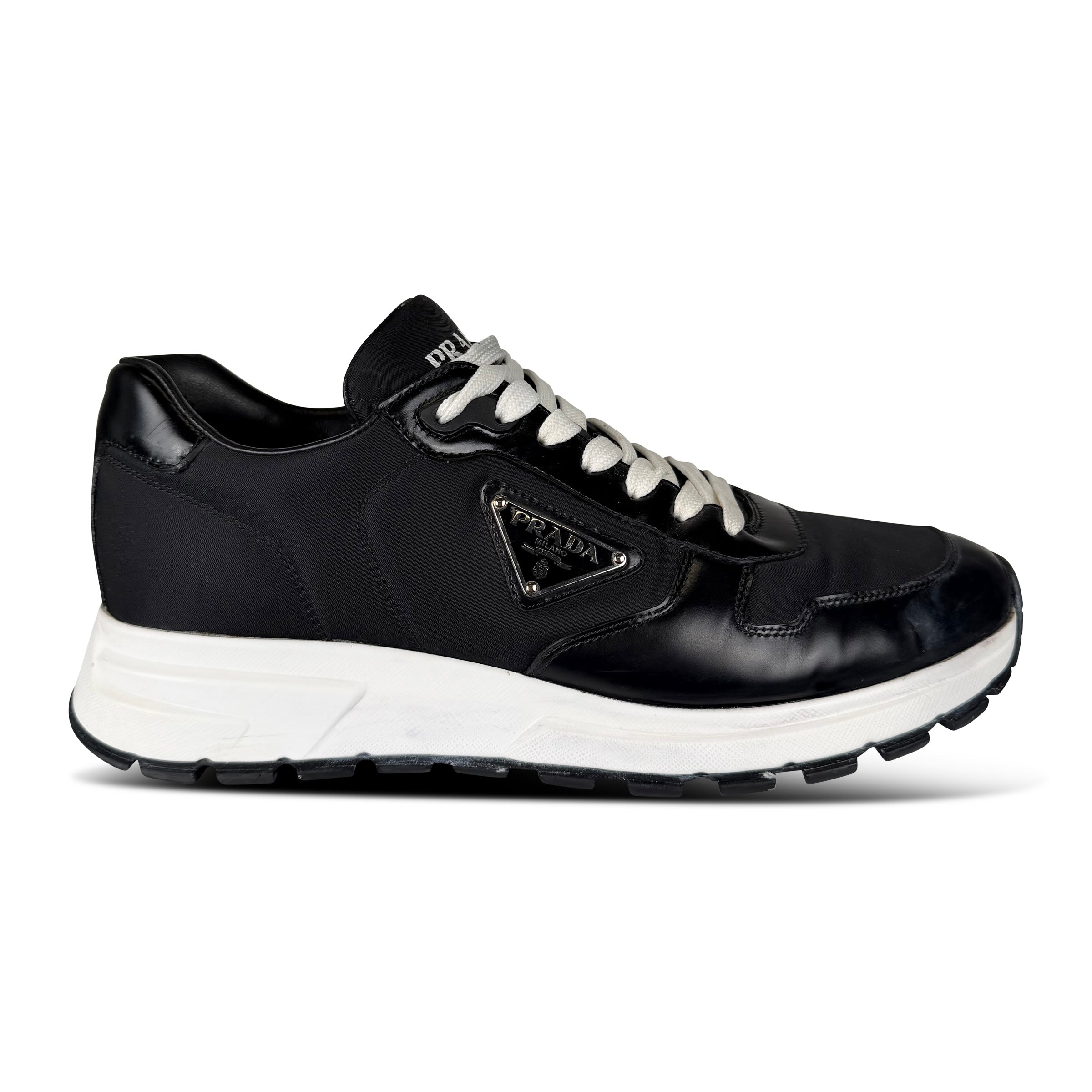 PRADA BLACK LOGO TRAINER - UK 8 (Fit 9) - Affluent ArchivesUsed HIGH END DESIGNER CLOTHING