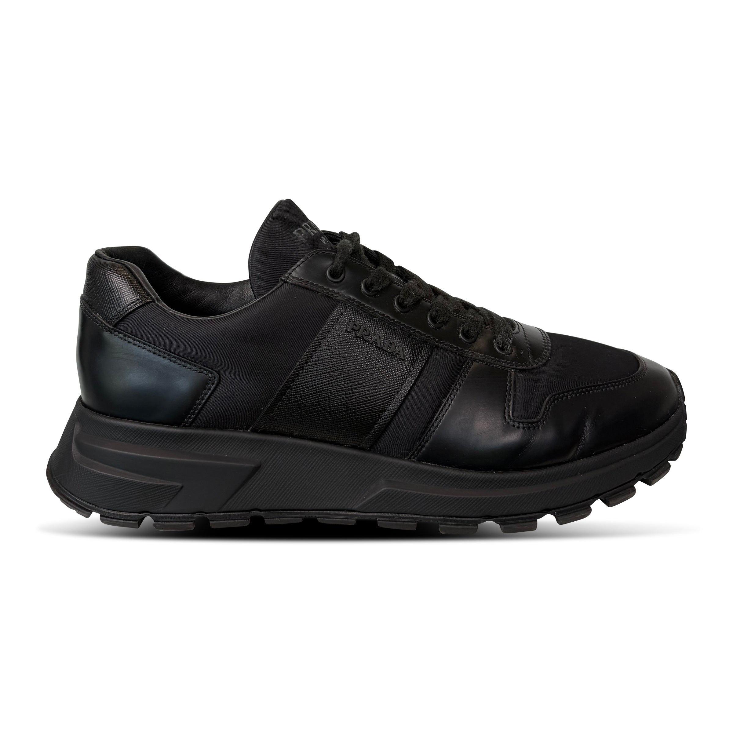 PRADA BLACK LOGO TRAINER - UK 9 (Fits 10) - Affluent ArchivesUsed HIGH END DESIGNER CLOTHING