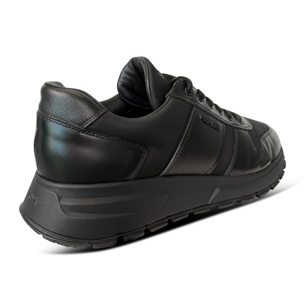 PRADA BLACK LOGO TRAINER - UK 9 (Fits 10) - Affluent ArchivesUsed HIGH END DESIGNER CLOTHING