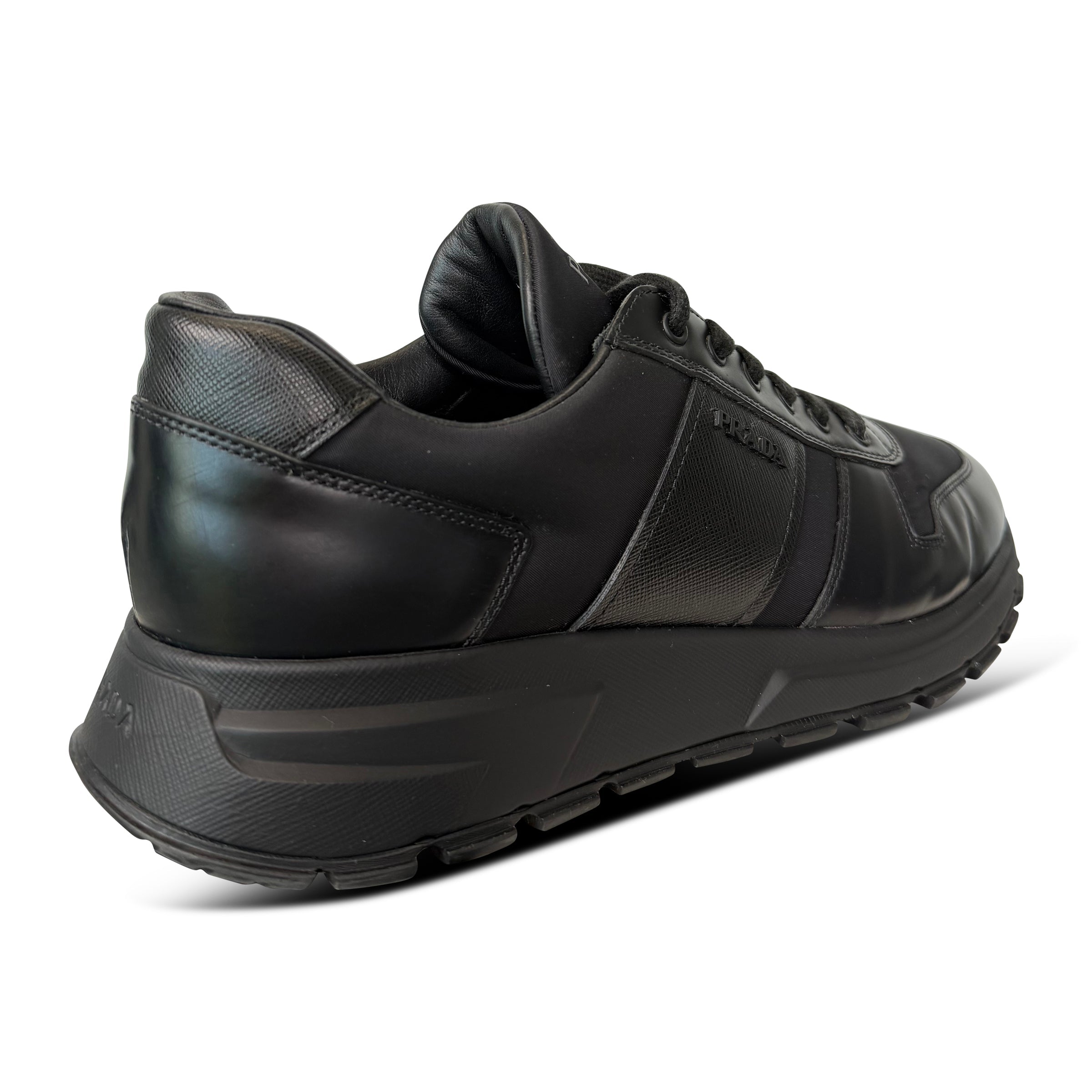 PRADA BLACK LOGO TRAINER - UK 9 (Fits 10) - Affluent ArchivesUsed HIGH END DESIGNER CLOTHING