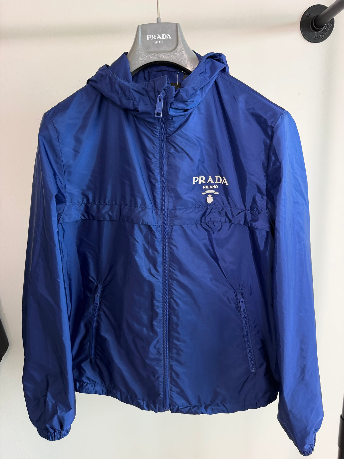 PRADA LOGO BLUE WINDBREAKER - MEDIUM (48) | PRE OWNED - Affluent ArchivesUsed HIGH END DESIGNER CLOTHING